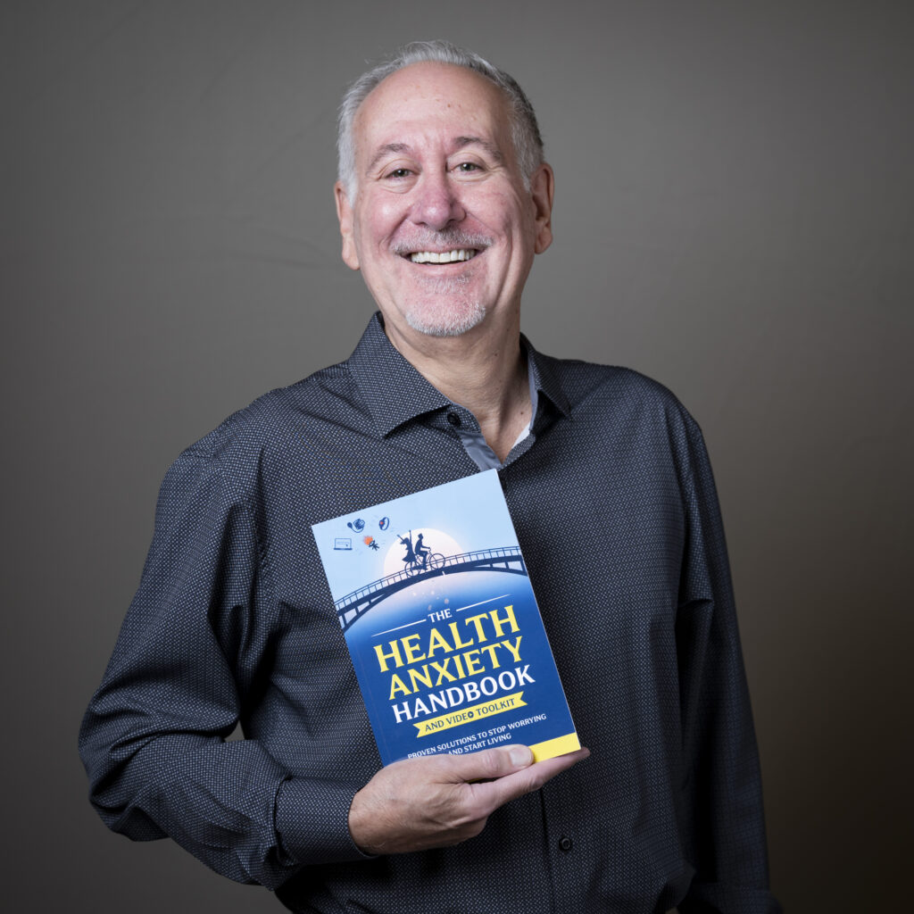 Ken holding book - Beat Health Anxiety